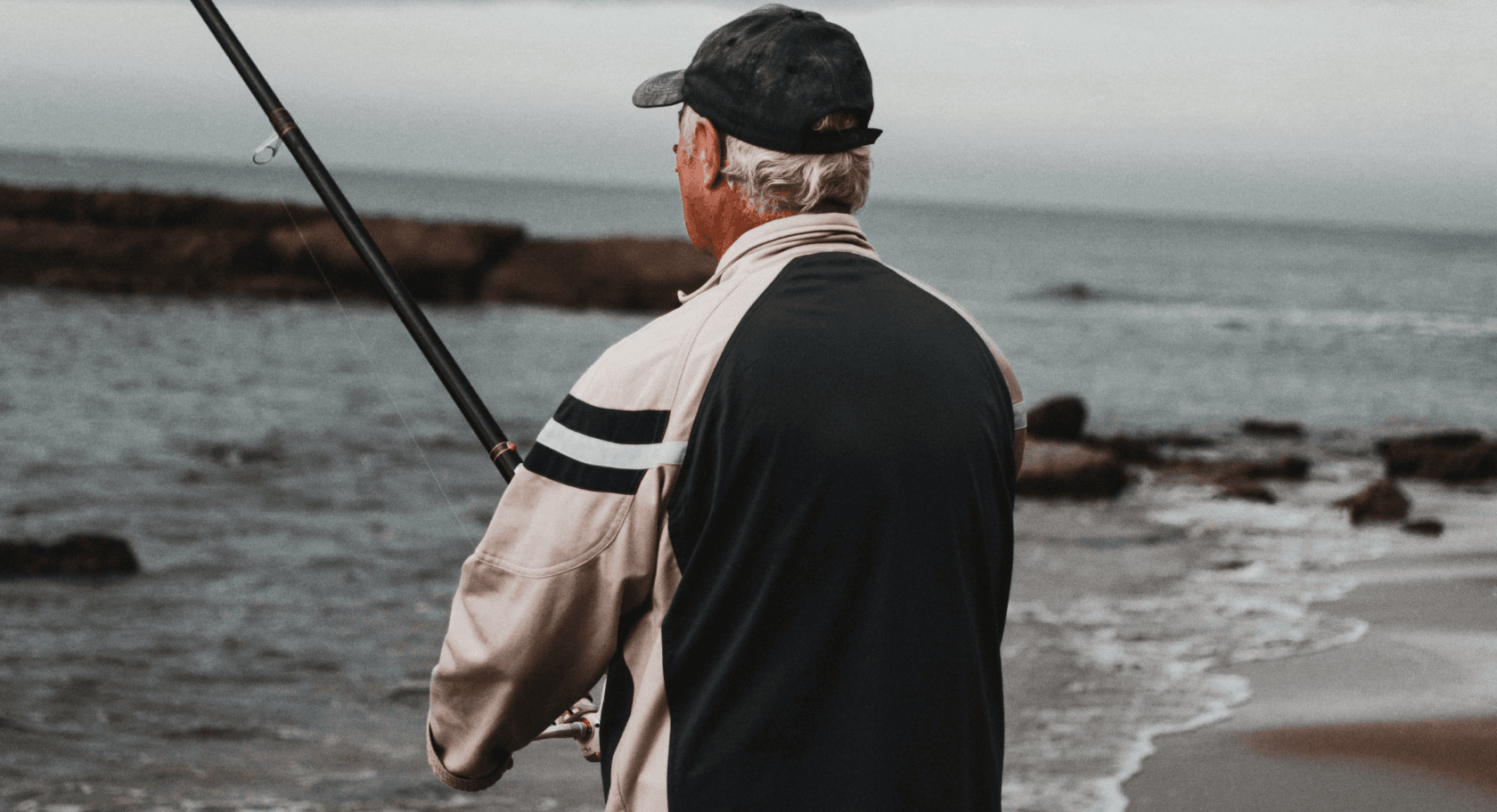 Person fishing at the ocean